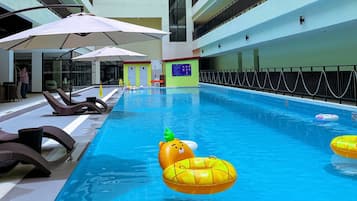 Outdoor pool, open 7:00 AM to 11:00 PM, pool umbrellas