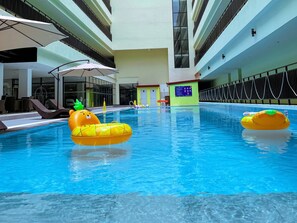 Outdoor pool, open 7:00 AM to 11:00 PM, pool umbrellas