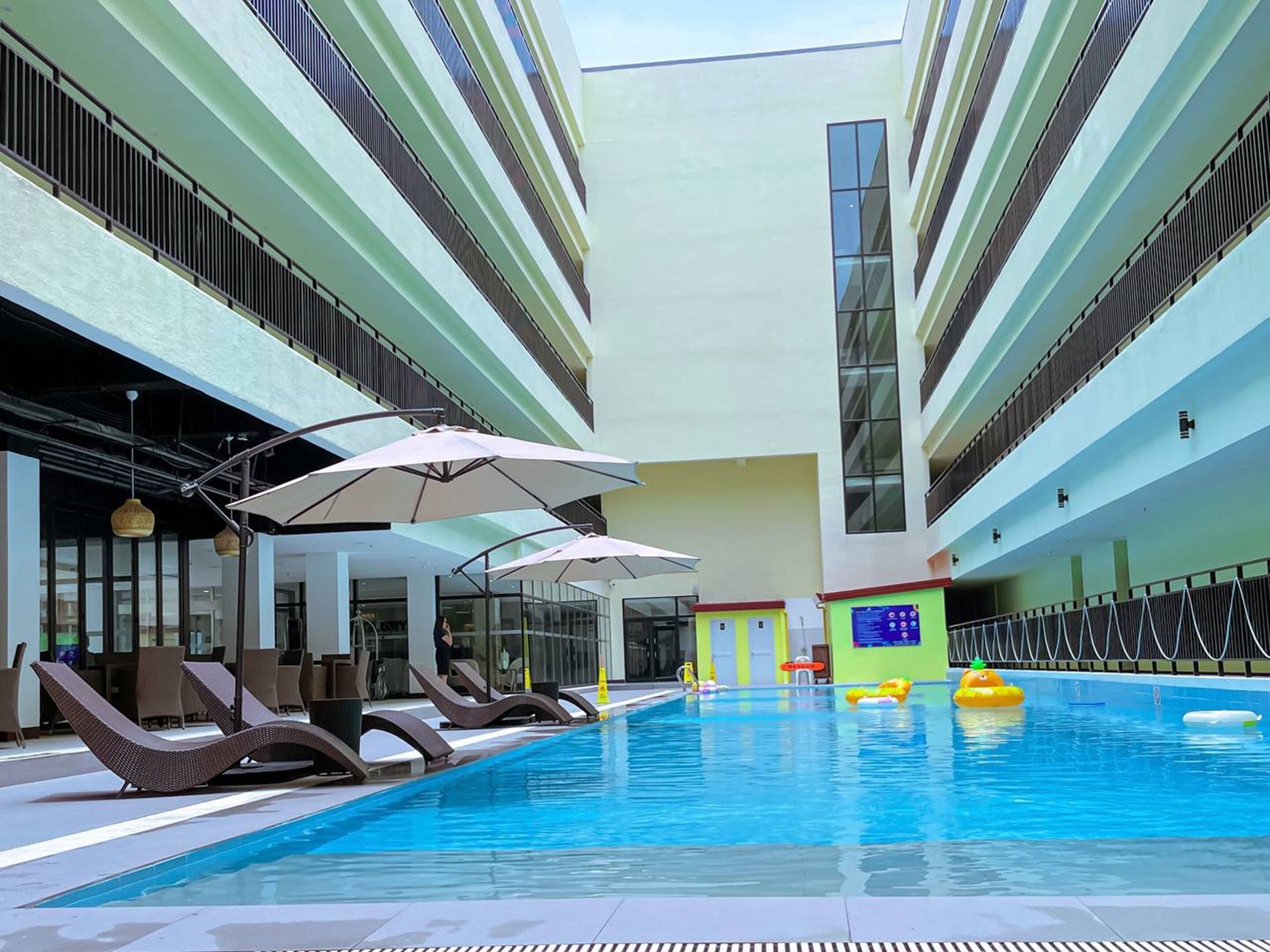 Outdoor pool, open 7:00 AM to 11:00 PM, pool umbrellas