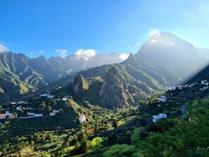 Set amidst lush greenery, this serene retreat offers a tranquil escape amidst rugged mountains.