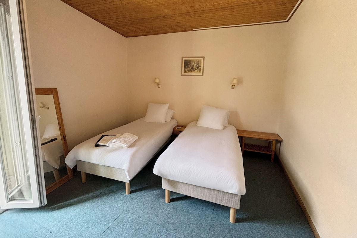 Desk, laptop workspace, free WiFi, bed sheets
