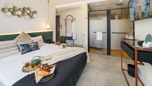 A hotel room with a bed, bedside table, and a desk with a chair. - Luff Living Adult Only (+12) (Antalya)