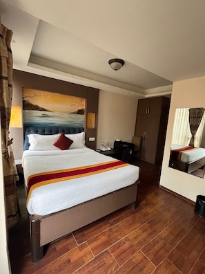 Deluxe Quadruple Room | Premium bedding, pillowtop beds, soundproofing, iron/ironing board