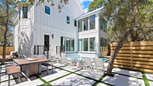 A modern house with a pool, outdoor seating, and a fire pit. - The Blue Pearl at Grayton|Golf Cart to Beach|Private Pool (Santa Rosa Beach)