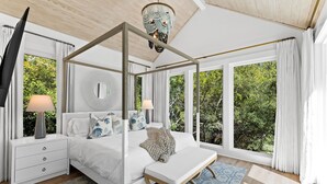 A four-poster bed with a canopy, white bedding, and a bench. - The Blue Pearl at Grayton|Golf Cart to Beach|Private Pool (Santa Rosa Beach)