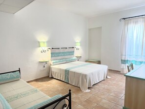 Habitación triple superior | Ropa de cama 