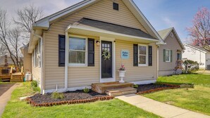A single-story house with a front porch, a small garden area, and a sign that reads "Harbor Haven."