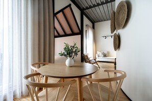 Enjoy meals in this stylish dining area with a round table and comfortable seating for four.