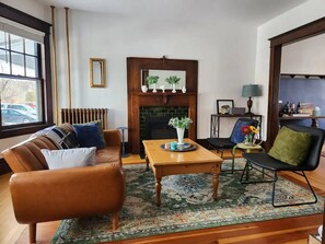 Smart TV, fireplace, books, printers