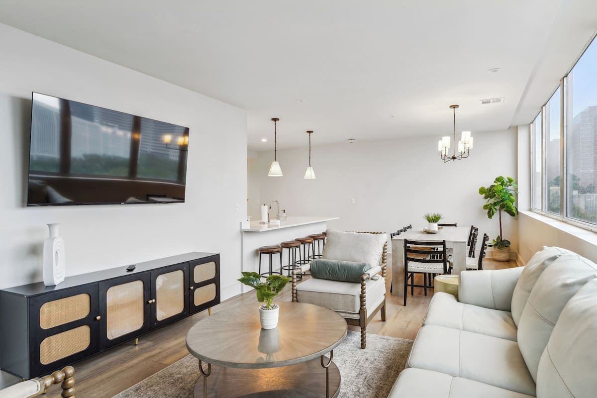 Family Condo, 4 Bedrooms | Living area | 55-inch Smart TV with cable channels, streaming services