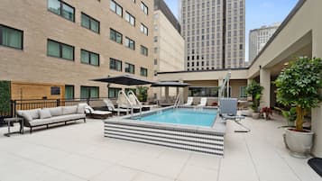 Seasonal outdoor pool, open 8:00 AM to 10:00 PM, pool umbrellas