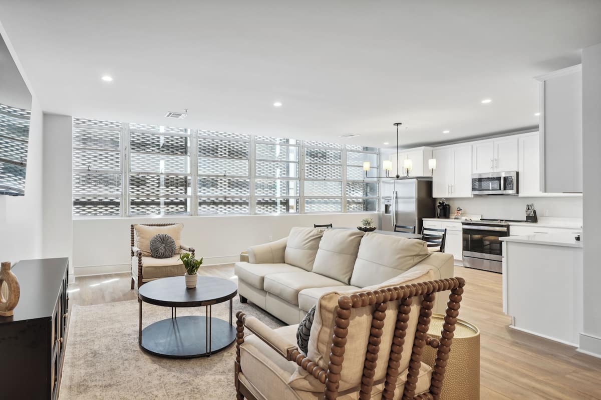 Premium Condo, 5 Bedrooms | Living area | 55-inch Smart TV with cable channels, streaming services