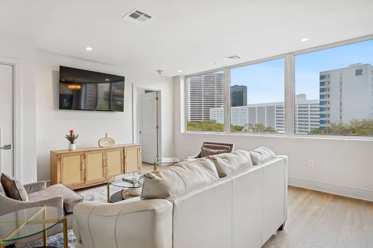 Family Condo, 4 Bedrooms | Living area | 55-inch Smart TV with cable channels, streaming services