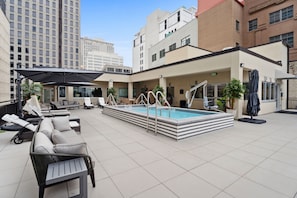 Seasonal outdoor pool, open 8:00 AM to 10:00 PM, pool umbrellas