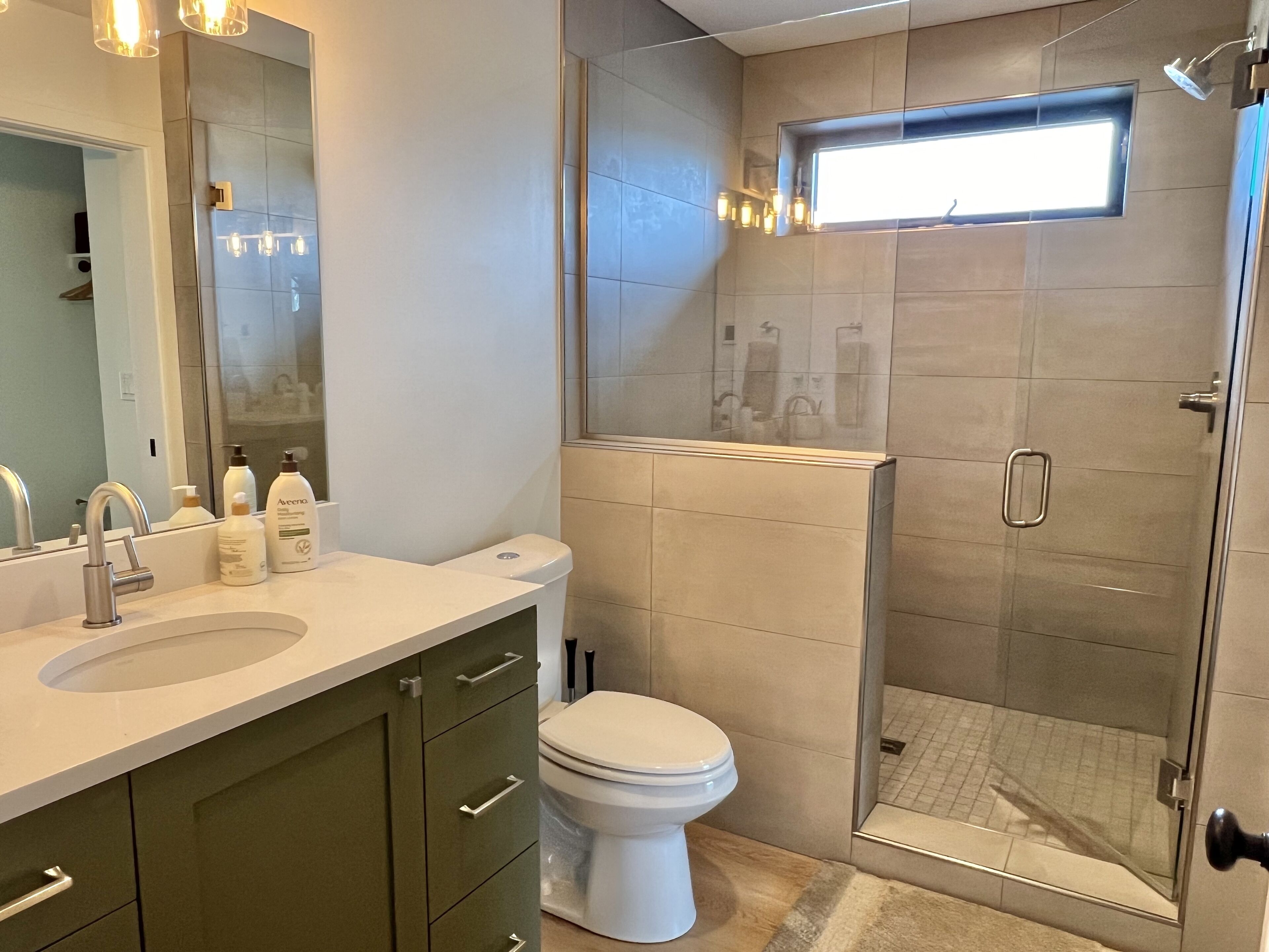Shower, hair dryer, towels, soap