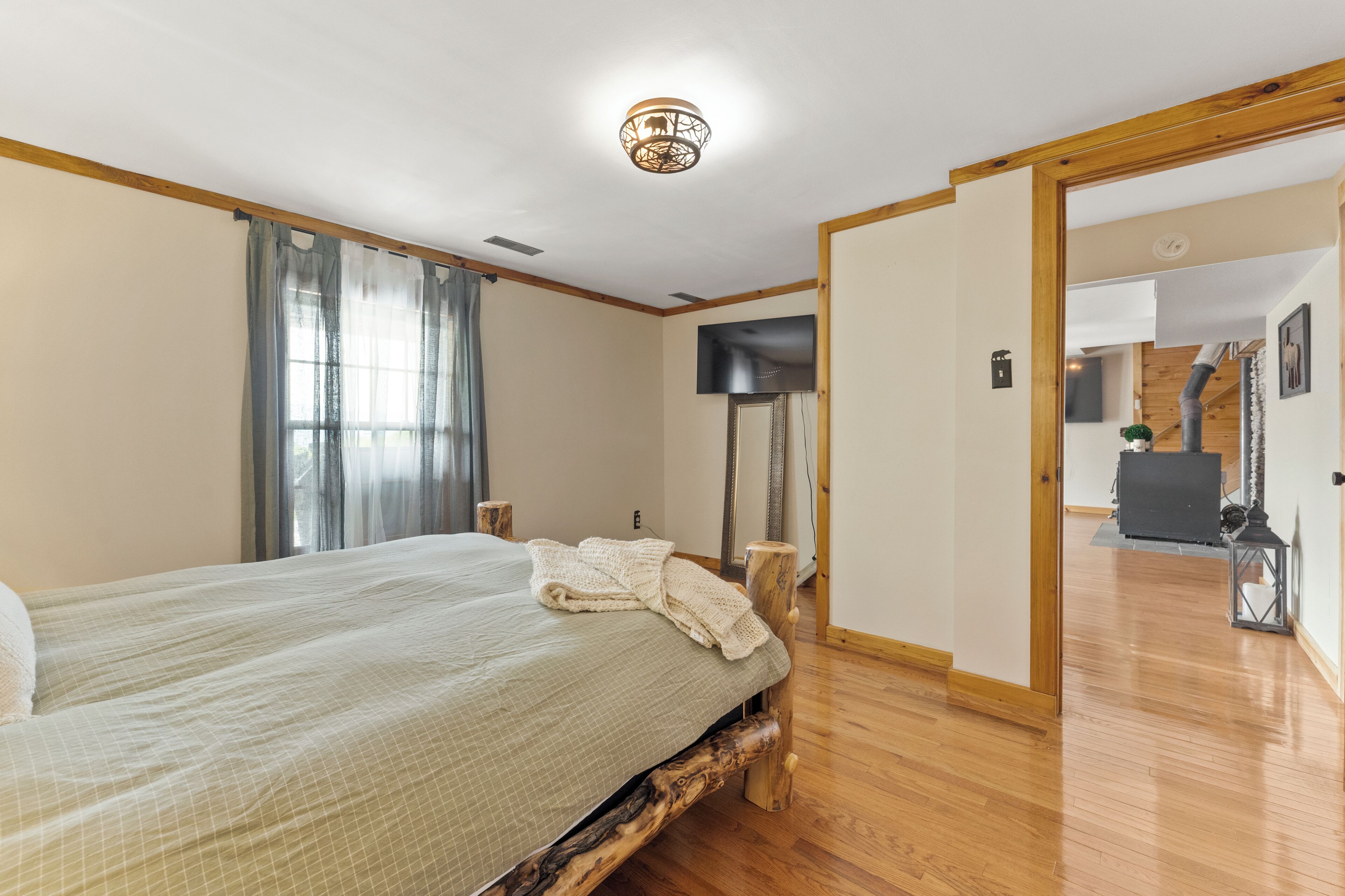 Third bedroom on lower level with mountain and lake views.