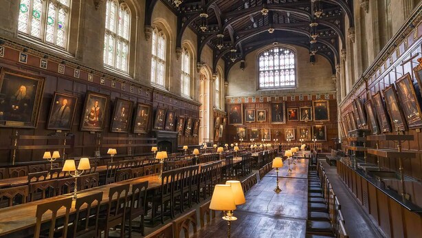 A large hall with rows of wooden benches and tables, high ceilings with intricate woodwork, and large stained glass windows. - ☀ Sunny, Victorian 2BR Townhouse ☀ Oxford - Pass the Keys (Oxford)