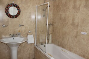 Shower, hair dryer, towels, shampoo