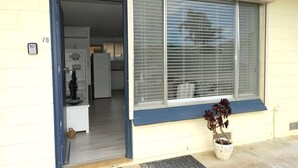A residential entryway with a door leading to a kitchen. - Hamptons, Port Vincent (Port Vincent)