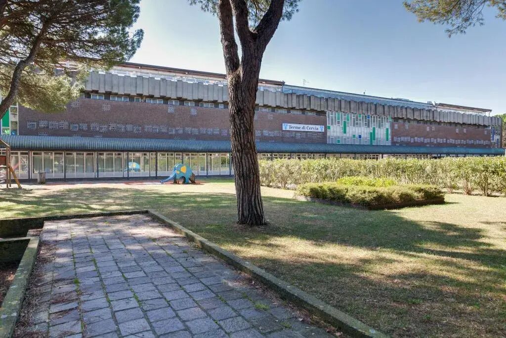 A building with a brick facade and a sign reading "Termine di Cervo."