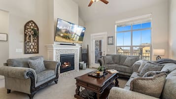 Apartment, 1 Queen Bed, Balcony (6582 Crystal Downs #205) | Living area | 70-inch flat-screen TV with digital channels, TV, fireplace