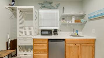Fridge, microwave, coffee/tea maker, cookware/dishes/utensils