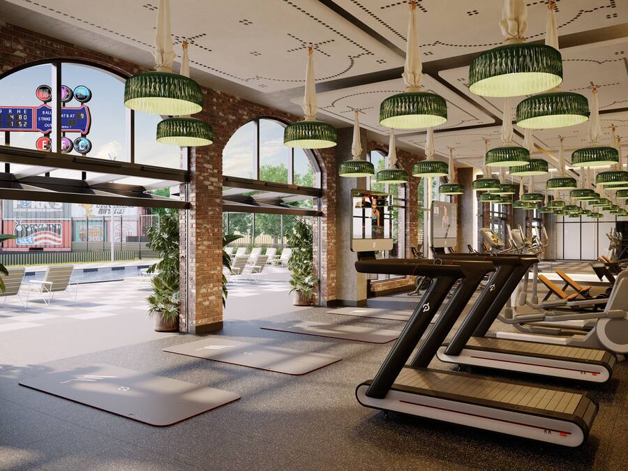 A gym with treadmills, stationary bikes, and exercise mats.