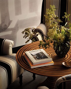 Sitting area in hotel lobby at Memoir Wedgewood Houston