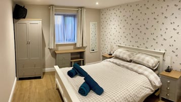 1 bedroom, desk, iron/ironing board, travel crib
