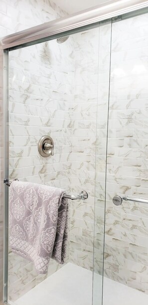 Shower, towels, soap, toilet paper