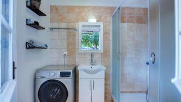 Shower, hair dryer, towels, toilet paper