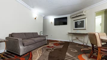 Grand Suite | Living area | 40-inch Smart TV with cable channels
