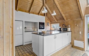 Fridge, stovetop, dishwasher, coffee/tea maker