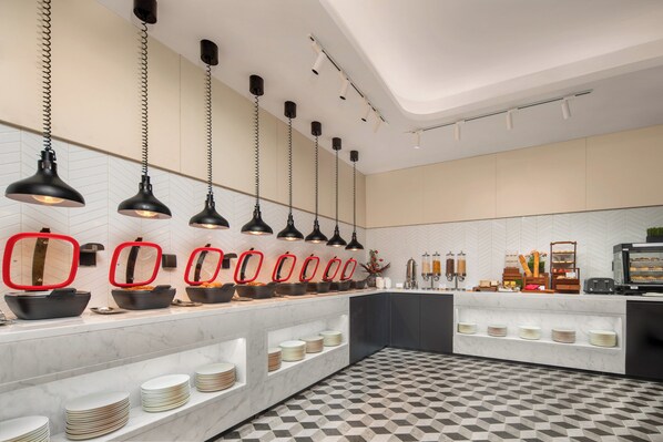 A modern kitchen with a marble countertop, black pendant lights, and a checkered floor. - Holiday Inn Express Beijing Zhongguancun Tech Park by IHG (Beijing)