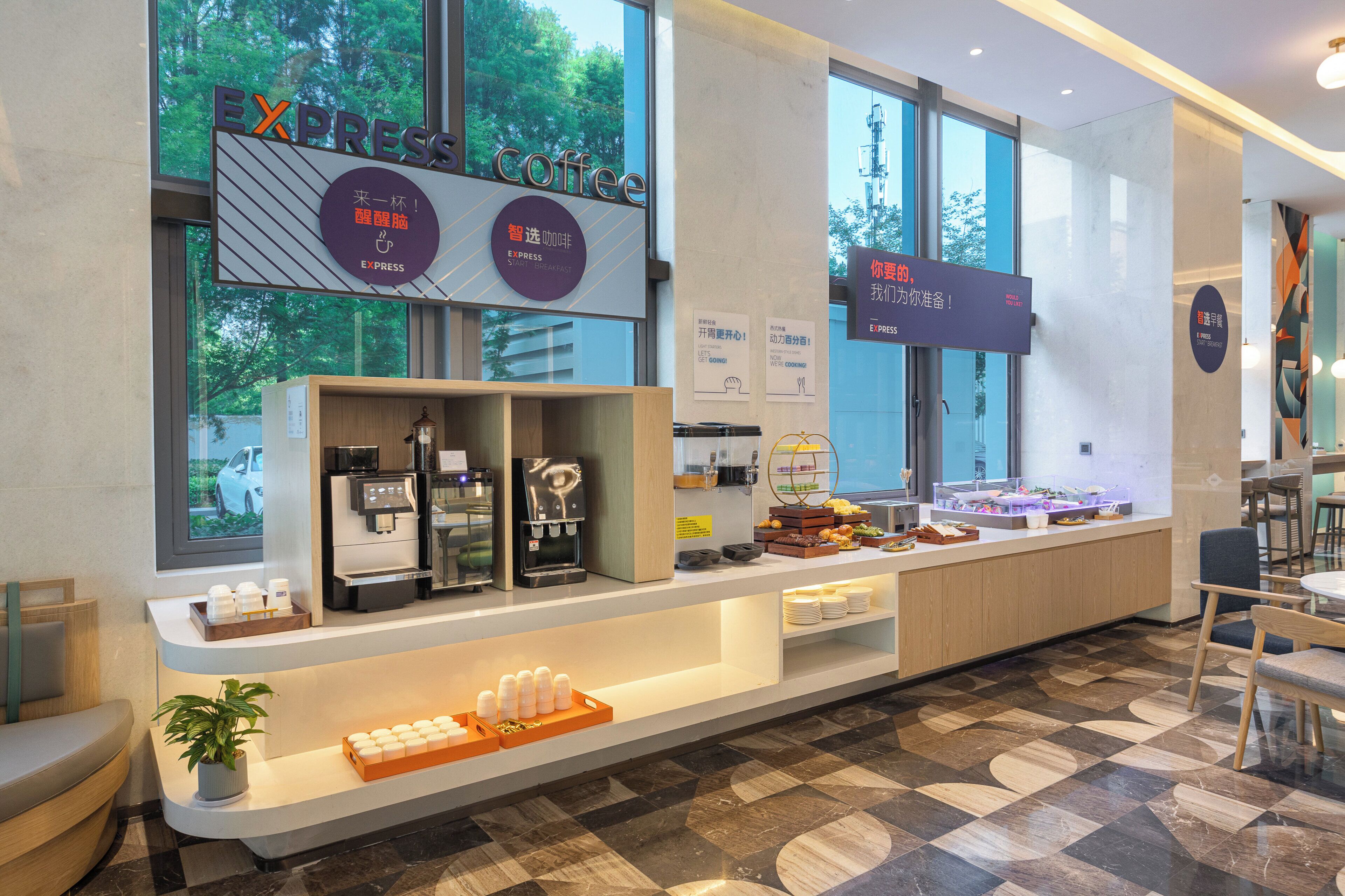 A modern coffee shop with a clean, minimalist design, featuring a coffee bar, seating area, and large windows offering a view of the outdoors.