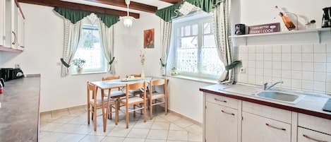 Fridge, stovetop, dishwasher, coffee/tea maker