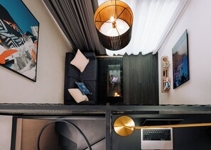 Skyloft Suite with Balcony | Living area | 55-inch Smart TV with digital channels, books, streaming services - Cascada (Portland)