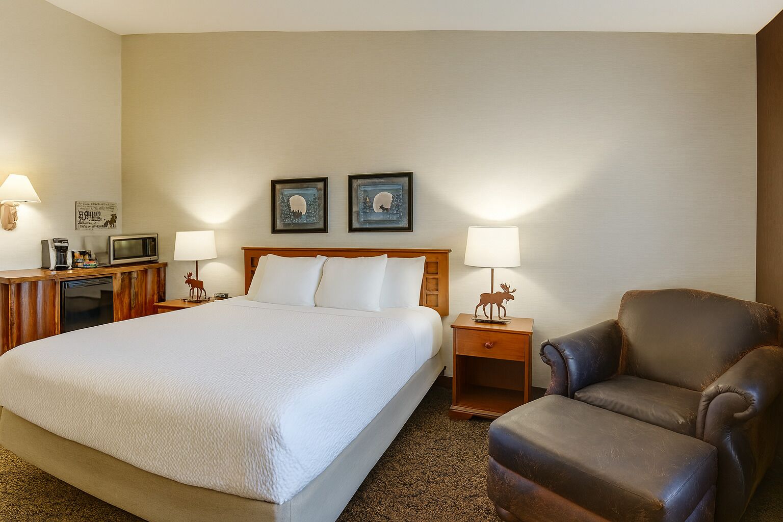 Relax into a restful king bed beside cozy lounge seating.