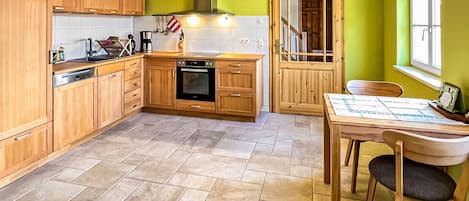 Fridge, stovetop, dishwasher, coffee/tea maker