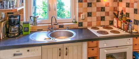Fridge, stovetop, dishwasher, coffee/tea maker