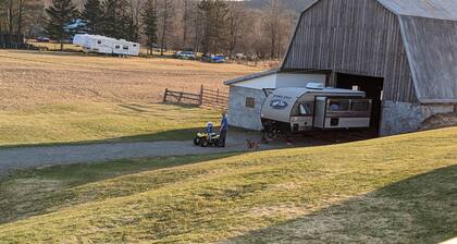 Rv parking spot with 30 Amp hook up and water. No dump station. Bring your toys!