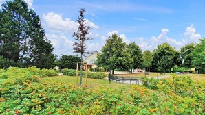 A park with benches, a gazebo, and a building labeled 'Gastronomy'. - 1 bedroom pet friendly apartment in Poseritz (Poseritz)