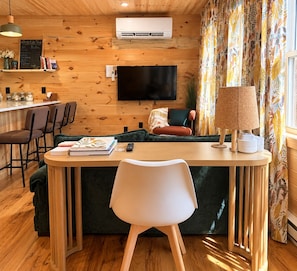Living area - 1 Bdr Cabin duplex unit on Apple River. Kayaks, SUPs & Sauna. Pet friendly! (Amery)