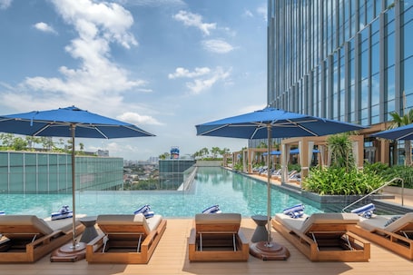 Outdoor pool, open 7:00 AM to 9:00 PM, lifeguards on site