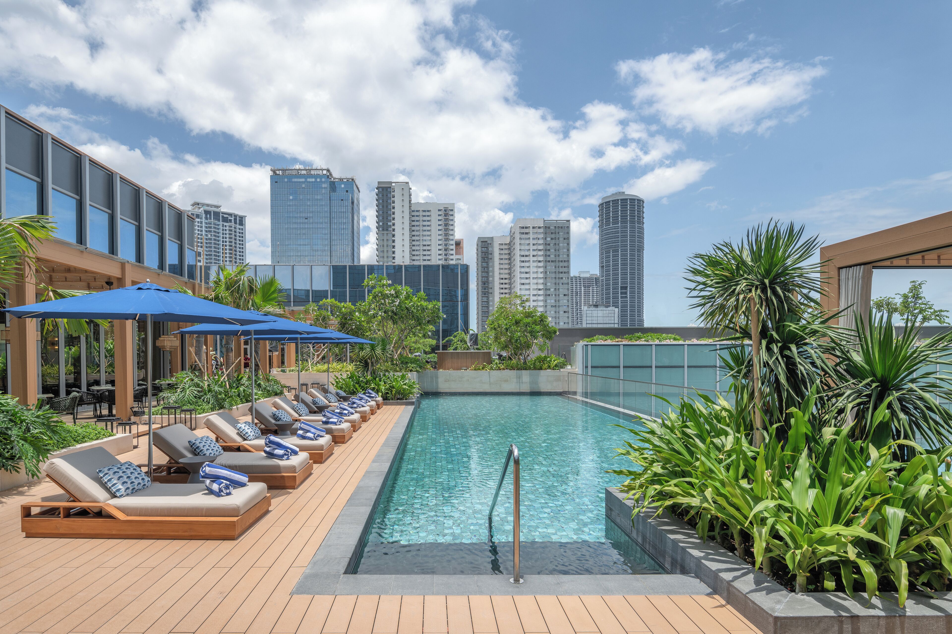 Outdoor pool, open 7:00 AM to 9:00 PM, lifeguards on site