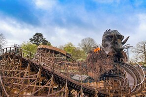 A large, complex roller coaster structure with multiple tracks and supports.