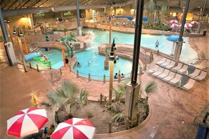 An indoor water park with multiple pools, slides, and lounge areas. - Double Diamond Lodge by Avantstay Group Escape w/ Firepit, Patio, Activities (Lake Harmony)