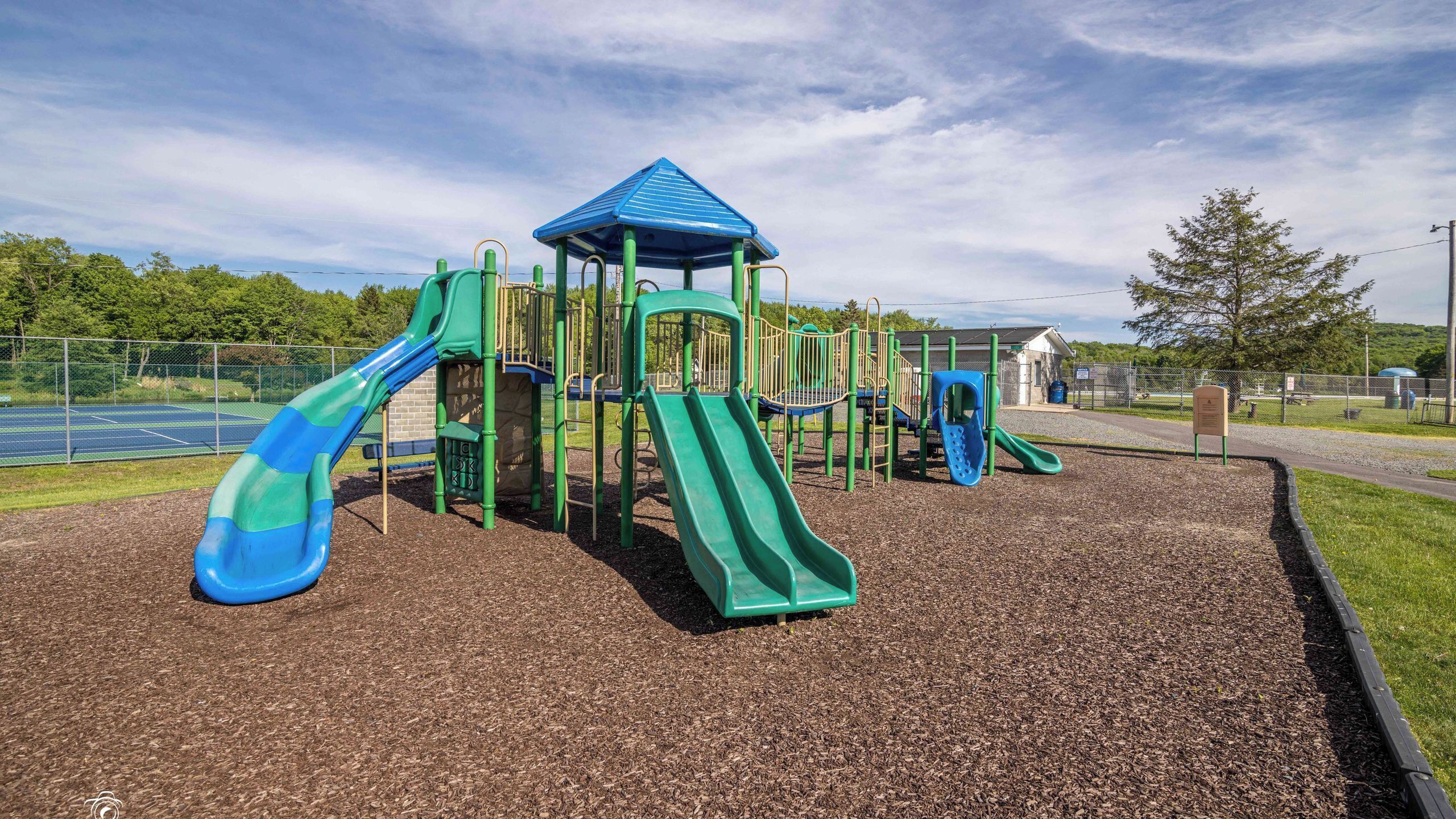A playground with slides and climbing structures.