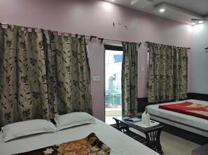 Family Room | Premium bedding, desk, laptop workspace, free WiFi