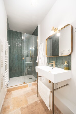 Shower, hair dryer, towels, soap